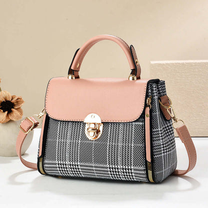 Pink envelope shoulder tote with gray houndstooth front panel and gold clasp