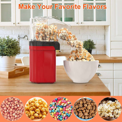 Red popcorn maker on a kitchen counter with a bowl of popcorn and flavor options displayed.