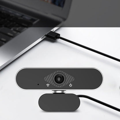 Webcam attached to a laptop on a white surface