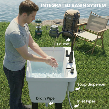 White utility sink with integrated basin parts, black faucet and soap dispenser