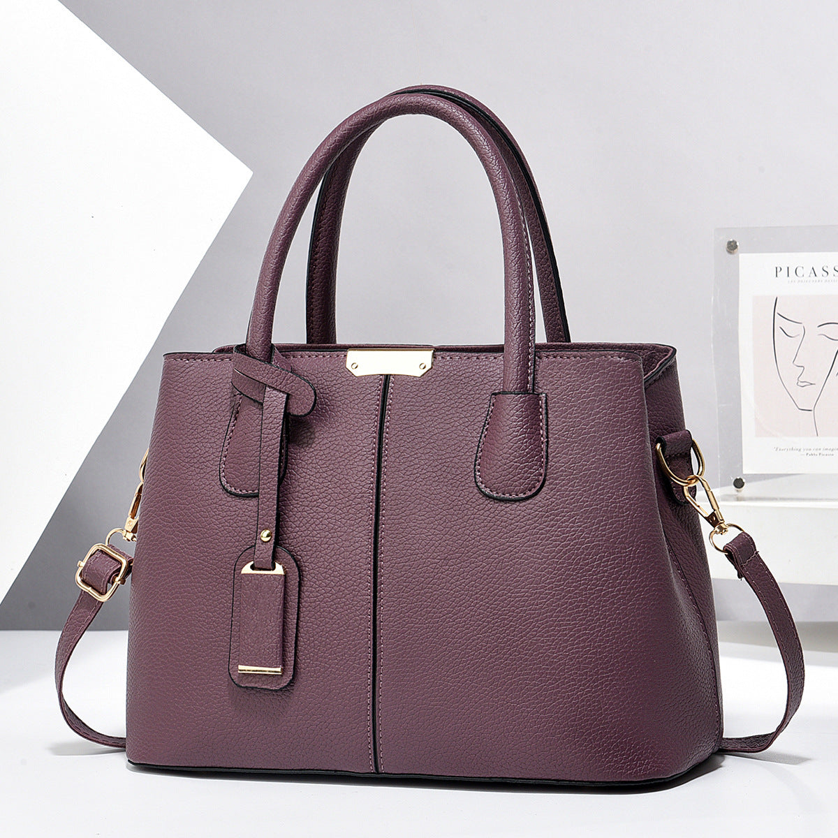 PU leather tote bag with top handles and crossbody strap, plum purple finish