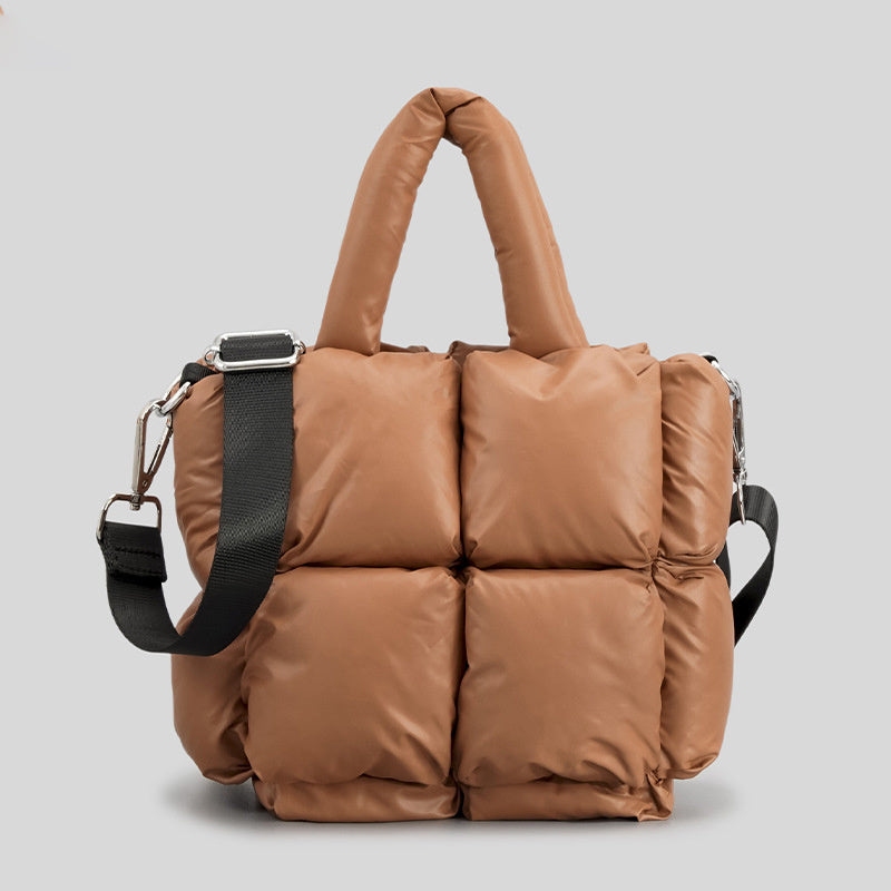 Puffer one-shoulder handbag in tan-brown with quilted panels, top handles, and strap