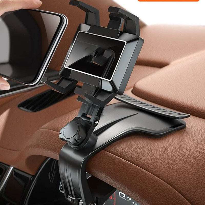 Car phone holder mounted on a car's dashboard with a brown interior.