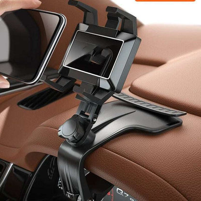 Car phone holder mounted on a car's dashboard with a brown interior.
