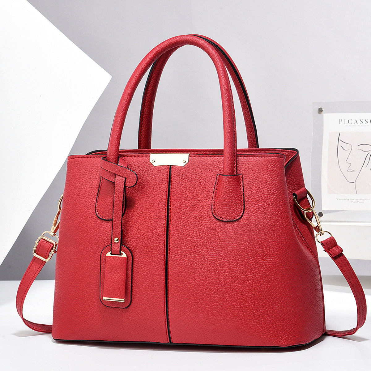 PU leather tote bag with top handles and crossbody strap, bright red finish