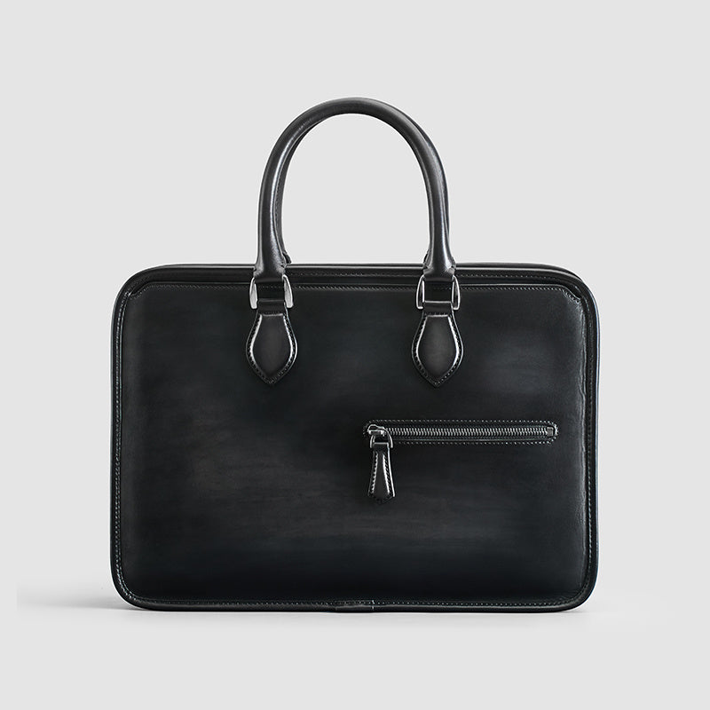 Men's vintage leather business bag in black with top handles and front zip pocket
