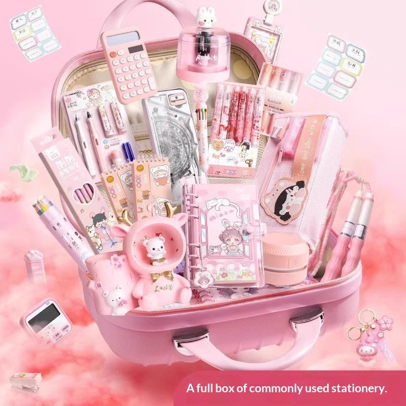 Pink stationery gift box with packed compartments of pens, markers, and sticker sheets