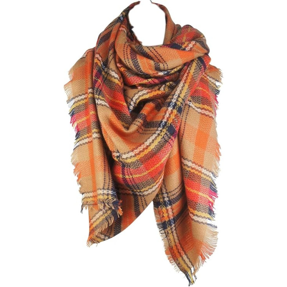 Plaid blanket scarf in orange and navy plaid with beige and red accents, fringed ends