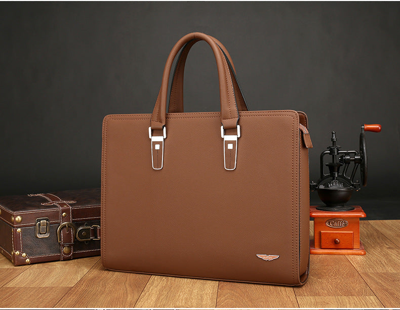 Men's tan business handbag briefcase with two top handle straps and metal buckle
