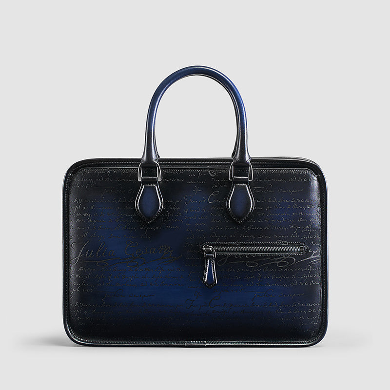 Men's vintage leather business bag in dark navy with script embossing and front zip pocket