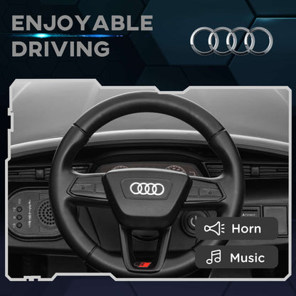 Kids ride-on car interior with black steering wheel and control buttons