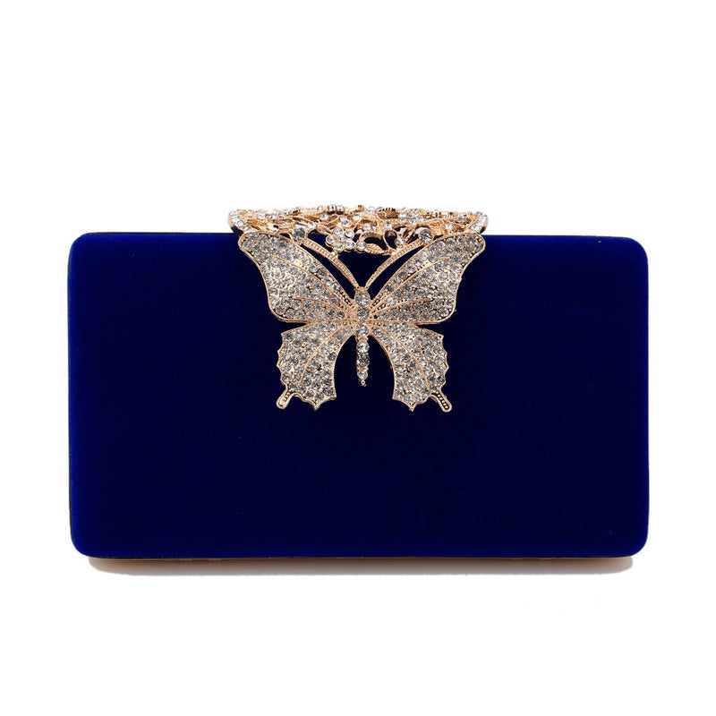 Dark blue velvet evening clutch with rhinestone butterfly clasp