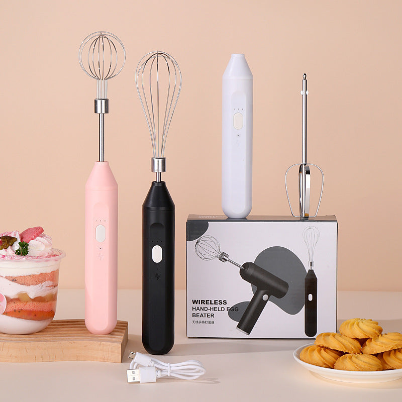 Wireless hand-held egg beater with packaging on a beige background