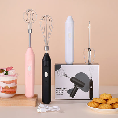 Wireless hand-held egg beater with packaging on a beige background