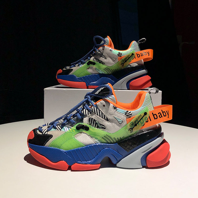 Color-block platform sneakers with green, blue, and orange accents and thick white sole