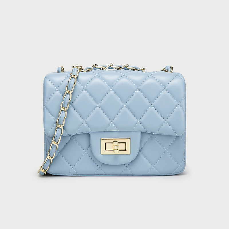 Light blue quilted mini messenger bag with gold chain strap and front flap square clasp