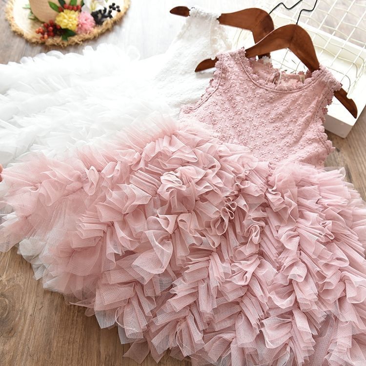 Girls lace princess dress laid flat, pale pink lace bodice and ruffled tulle skirt