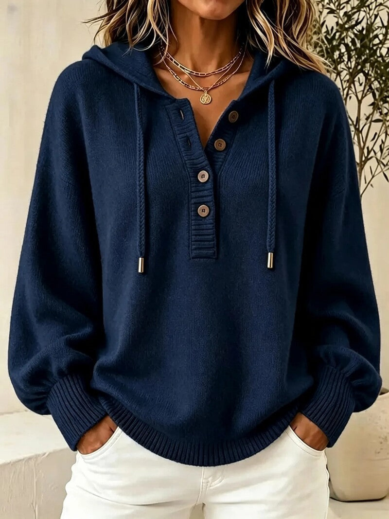 Navy hooded knit sweater with button placket, drawstring cords, and ribbed cuffs