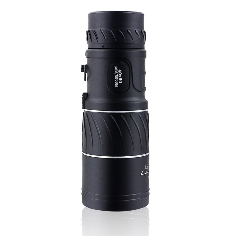 Black monocular telescope on a white background