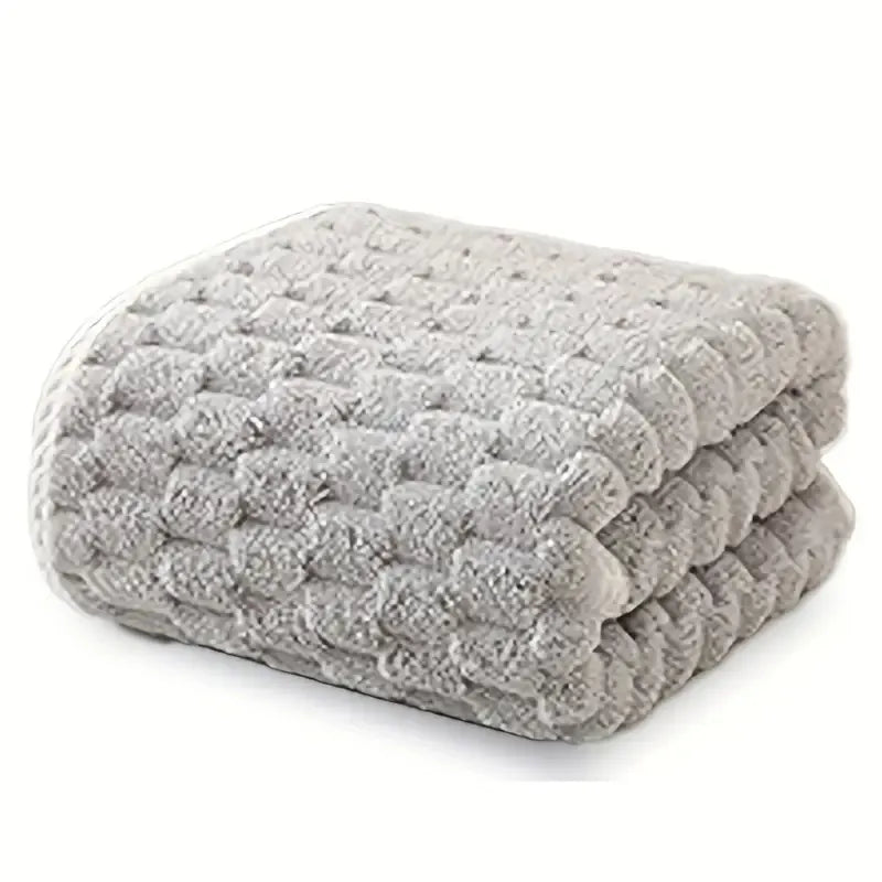 Waffle bath towel set, folded stack of gray towels with raised waffle pattern
