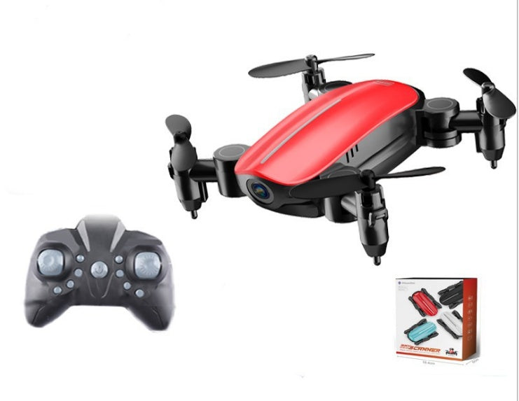 Red mini foldable quadcopter drone with camera, viewed from side with controller