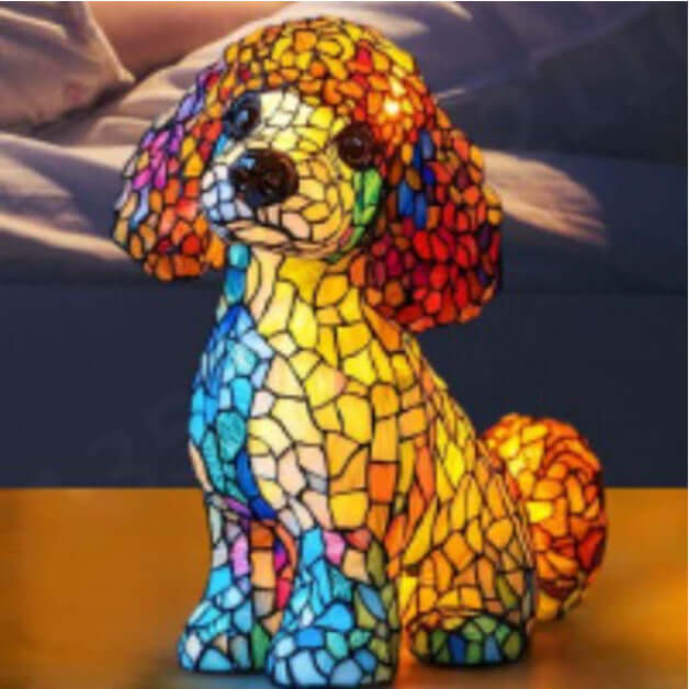 Colorful mosaic dog lamp with curly coat, sitting on a surface