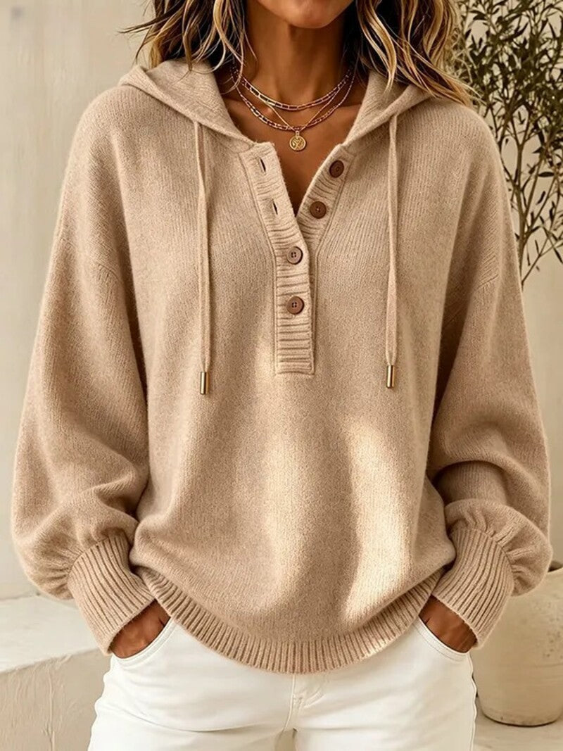 Beige hooded knit sweater with button placket, drawstring cords, and ribbed cuffs