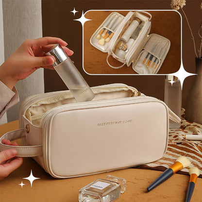 Cream cosmetic bag with double zippers, open inner compartments, and makeup tools inside