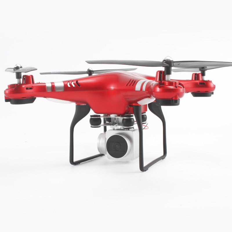 Red quadcopter drone with front camera lens and three visible propellers
