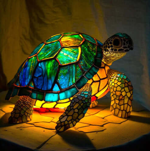 Colorful mosaic turtle-shell dog lamp with glowing base, side view