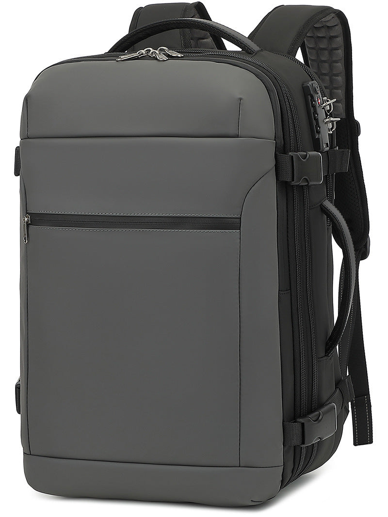 Gray lightweight backpack with front zipper pocket, side mesh panel, and adjustable straps