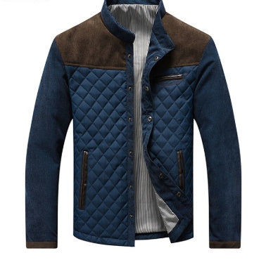 Blue quilted jacket with brown accents on a white background