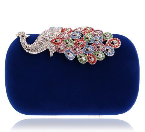 Blue velvet oval clutch with multicolor jewel floral fan clasp