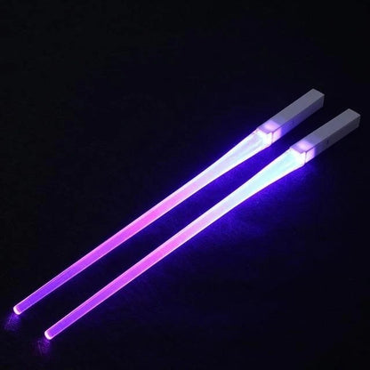 A reusable party utensil with nine colored fluorescent sticks and glowing chopsticks