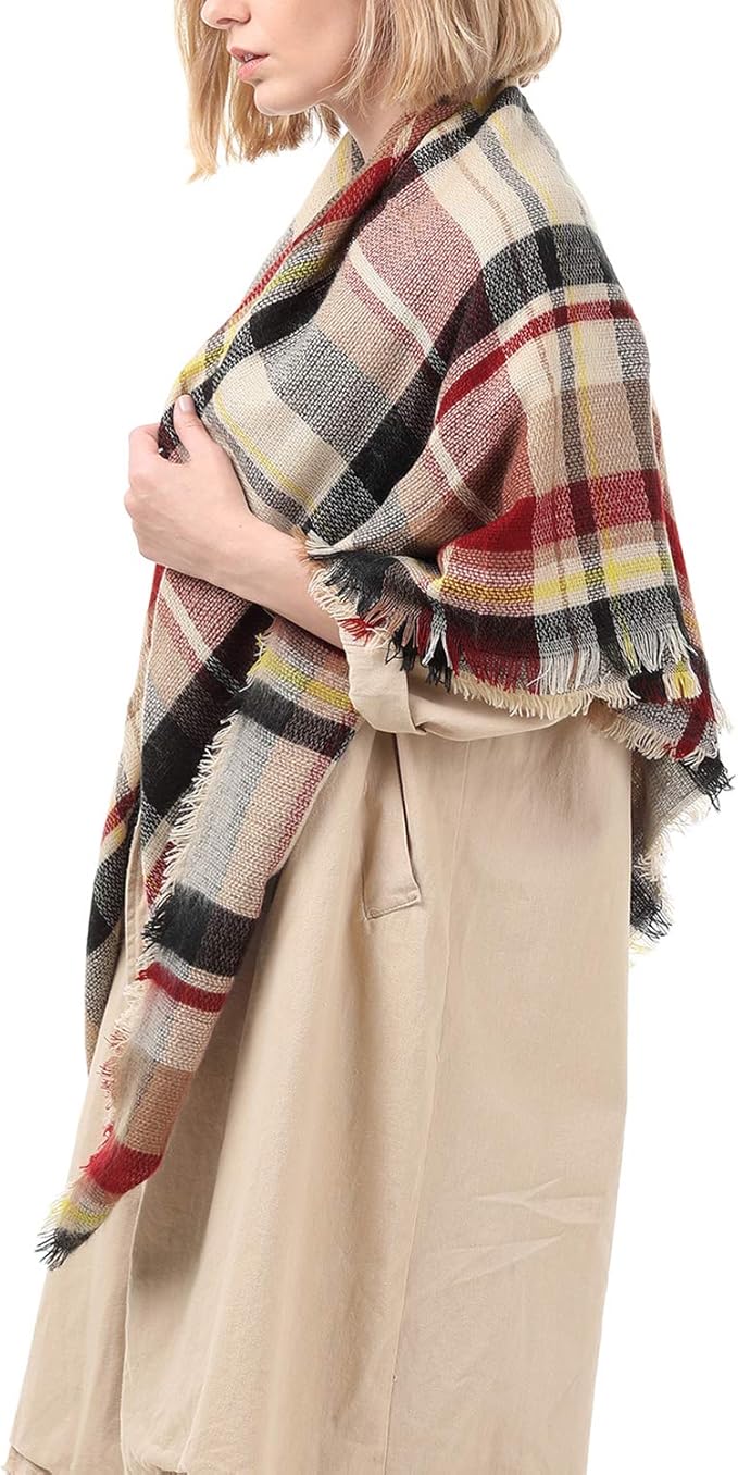 Women’s plaid scarf draped over shoulder, red and cream tones with fringe