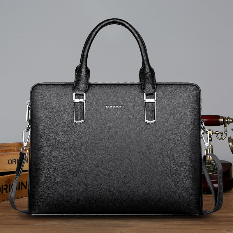 Men's black leather computer bag with two top handles and front metal buckle clasps