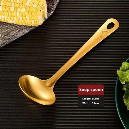 Gold soup spoon on a dark surface with text indicating its features.