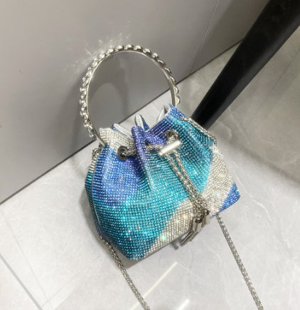 Blue rhinestone evening bucket bag with ring handle and tassel drawstrings