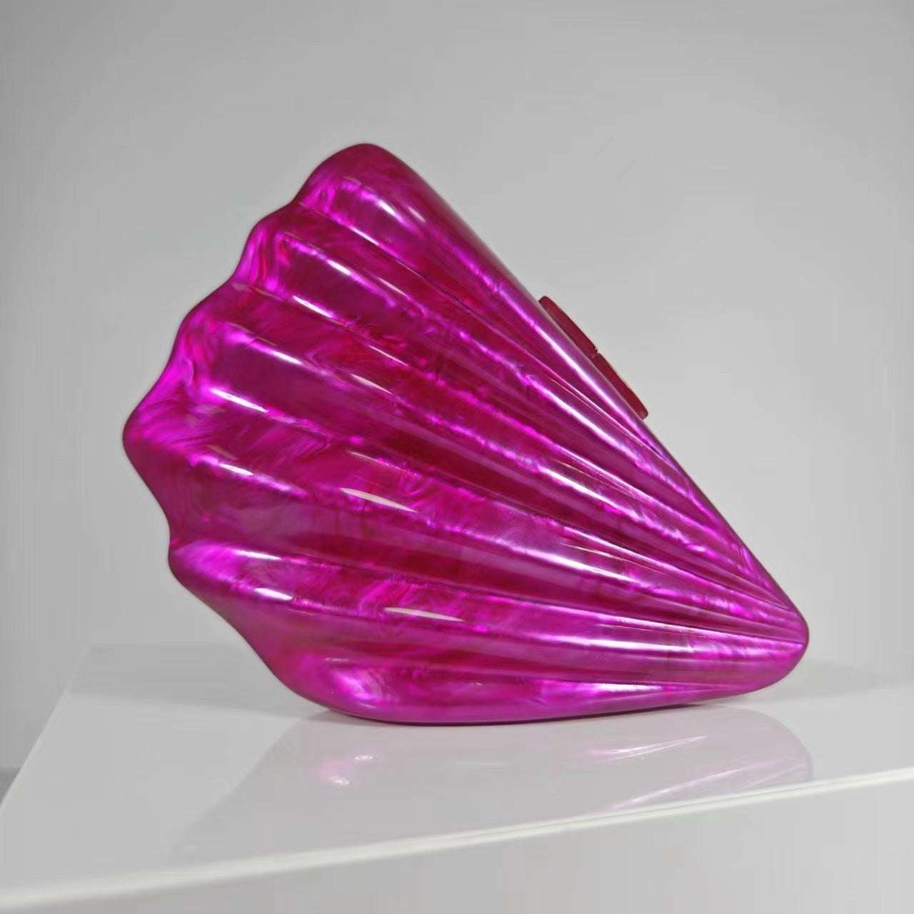 Women's acrylic crossbody bag, metallic magenta shell with curved flap and short strap