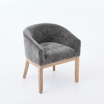 Gray chenille accent dining chair with angled legs and curved arms