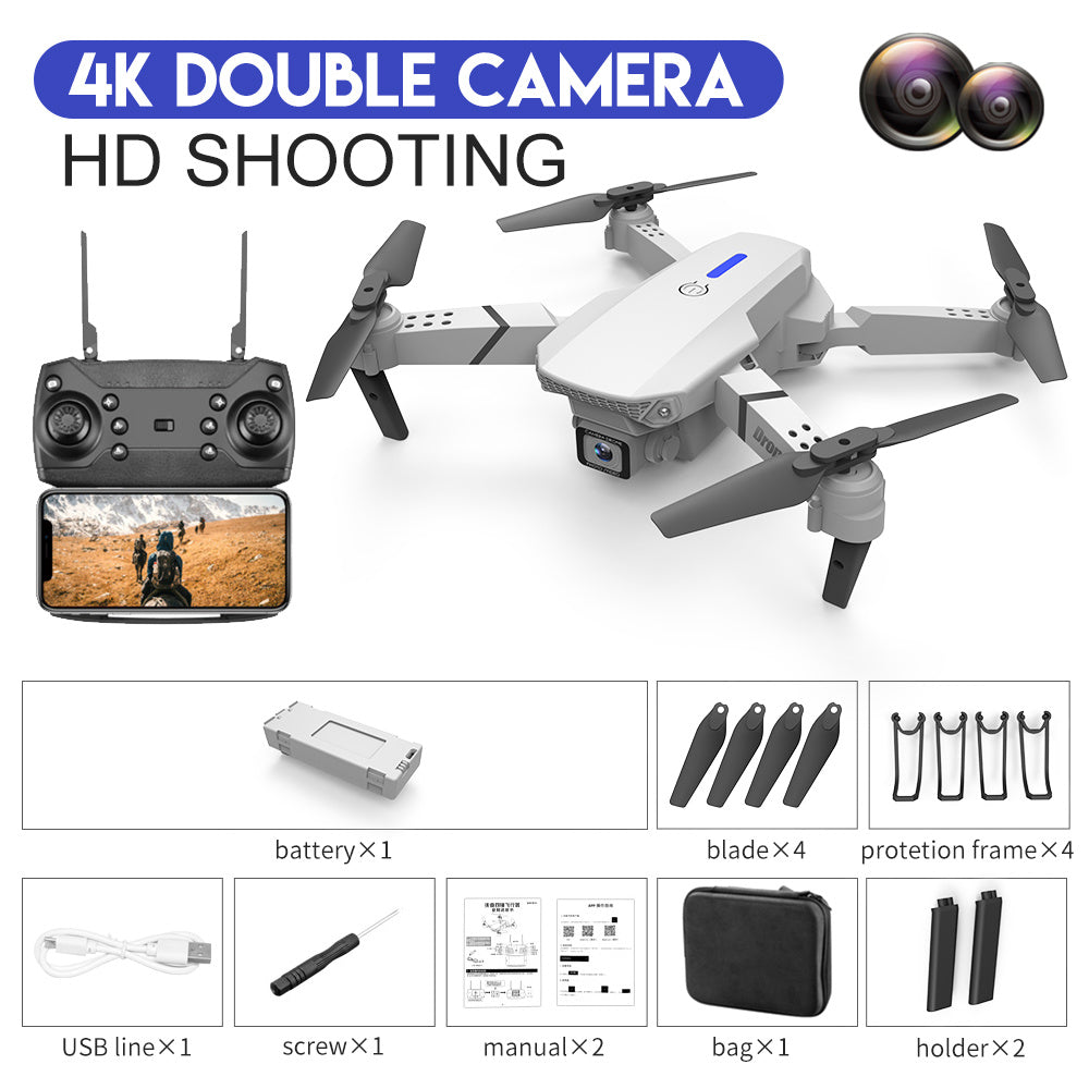 White quadcopter drone kit with dual-camera design, remote controller and spare blades