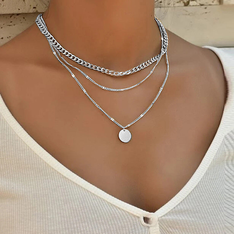 Silver multilayer disc pendant necklace with three layered chains and round disc charm