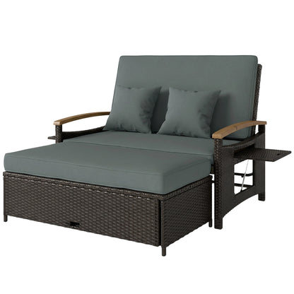 Gray rattan outdoor daybed with plush cushions and curved acacia wood armrests