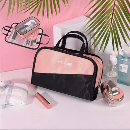 Cosmetic storage bag with clear top window and black handle, black and pink finish.
