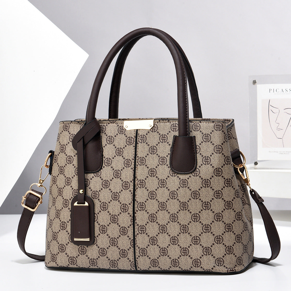 PU leather tote bag with top handles and crossbody strap, brown patterned design