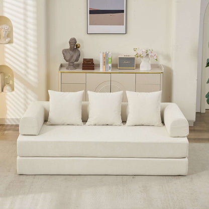 Beige convertible sofa bed front view with three back pillows and curved armrests