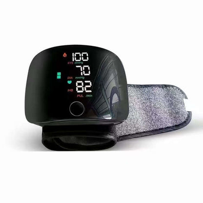 Black wrist blood pressure monitor with fabric wrist cuff and digital screen