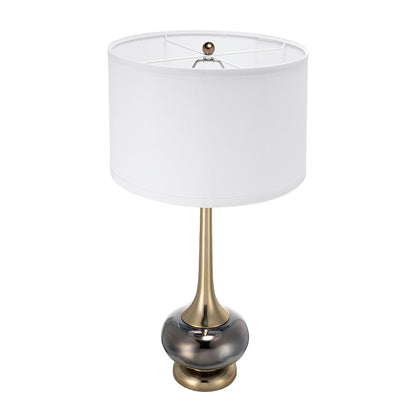 Table lamp with white fabric drum shade and gold metal base with top socket hardware