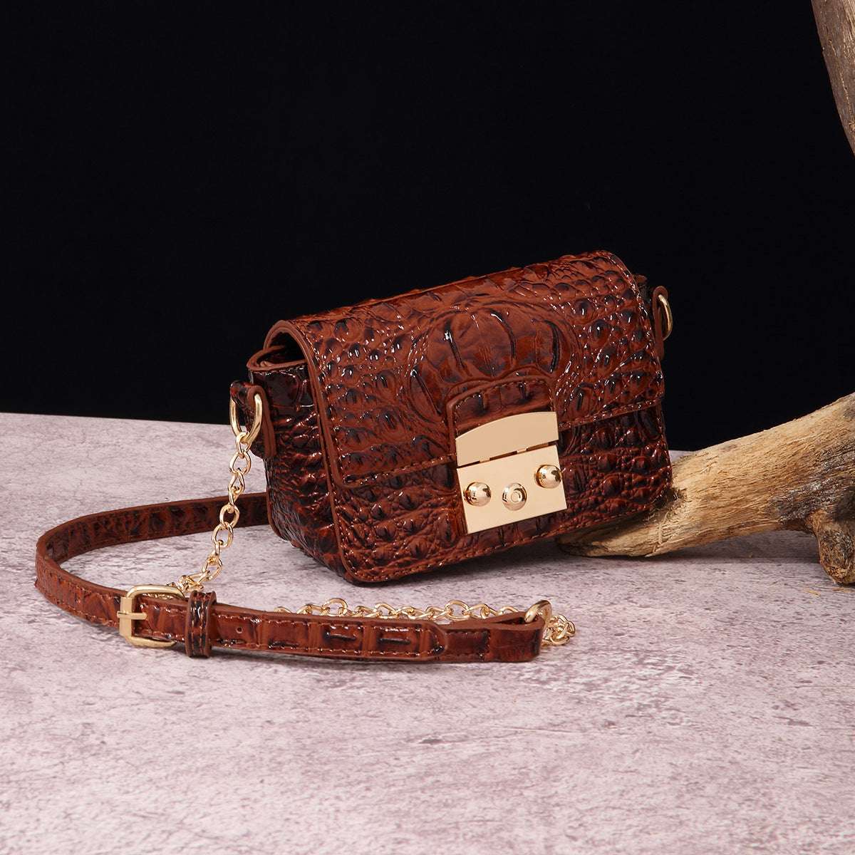 Rust brown croc-textured crossbody bag with flap and gold-tone lock hardware