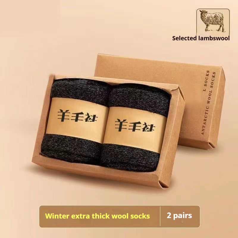 Two pairs of winter extra thick wool socks in a cardboard box with 'Selected lambswool' branding.